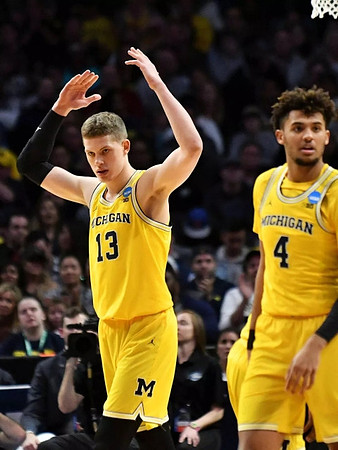 Moritz Wagner (13) and Isaiah Livers (4)