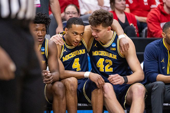 L.J. Cason (2), Nimari Burnett (4), and Will Tschetter (42)