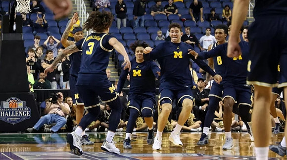 Tre Donaldson (3) and Michigan Team