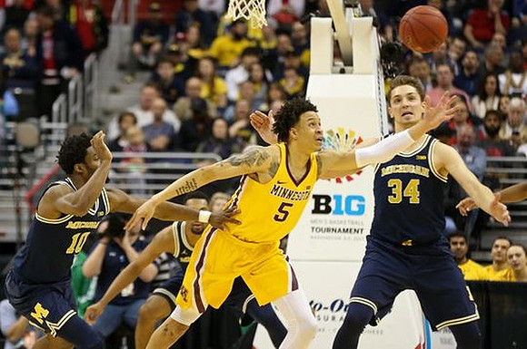 Derrick Walton Jr. (10) and Mark Donnal (34)