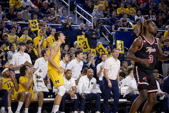 Vladislav Goldin (50) and Michigan Team