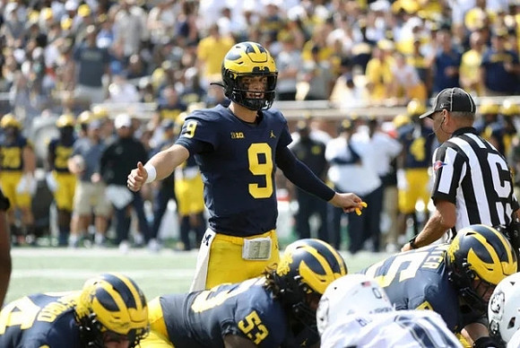 J.J. McCarthy (9), Joel Honigford (84), Trente Jones (53), and Zak Zinter (65)