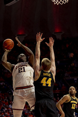 Jaron Faulds (44) and DeVante' Jones (12)