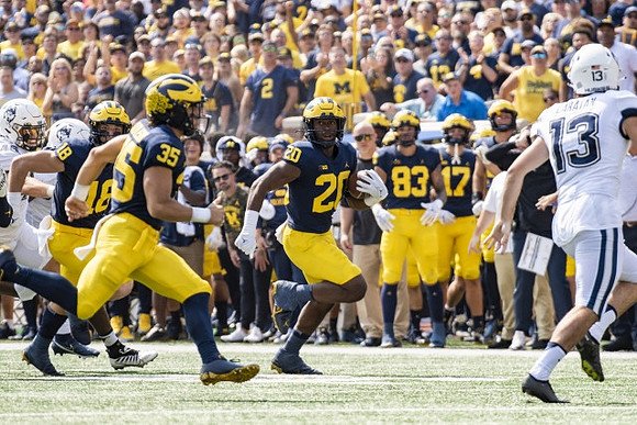 Colston Loveland (18), Caden Kolesar (35), and Kalel Mullings (20)