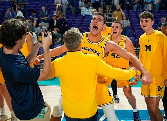 Dusty May, Vladislav Goldin (50), and Michigan Team
