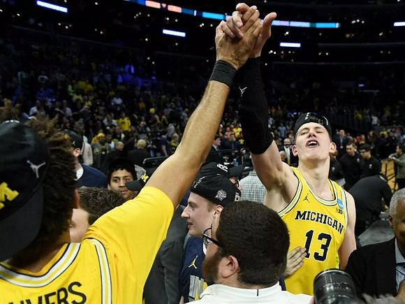 Isaiah Livers (4), Moritz Wagner (13), and Eli Brooks (55)