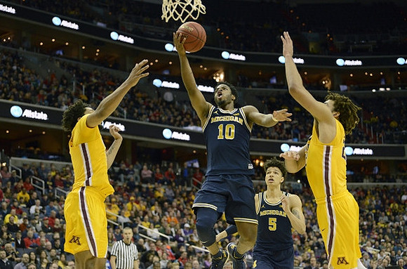 Derrick Walton Jr. (10) and D.J. Wilson (5)