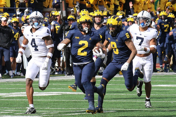 Blake Corum (2) and Ronnie Bell (8)