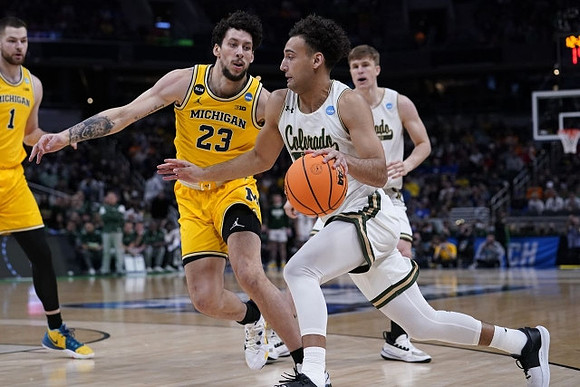Brandon Johns Jr. (23) and Hunter Dickinson (1)
