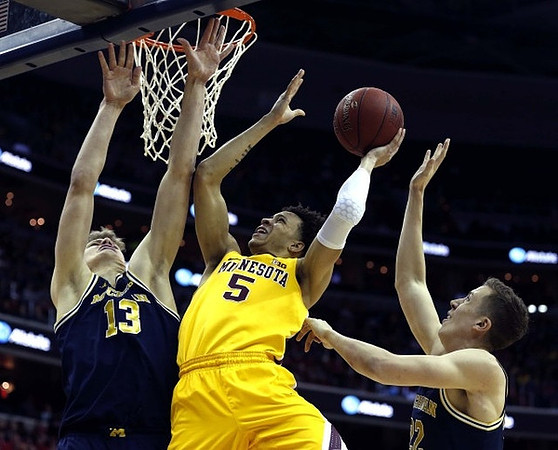 Moritz Wagner (13) and Duncan Robinson (22)