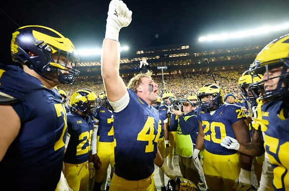 Max Bredeson (44) and Michigan Team