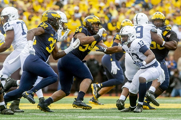 Jaylen Harrell (32), Kris Jenkins (94), and Mazi Smith (58)