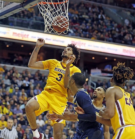 Muhammad-Ali Abdur-Rahkman (12) and Zak Irvin (21)