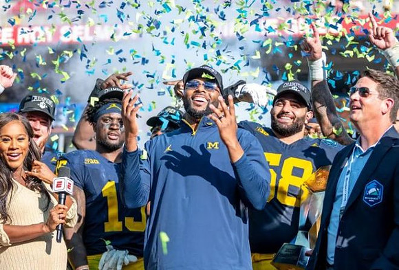 Ernest Hausmann (15), Sherrone Moore, and Giovanni El-Hadi (58)