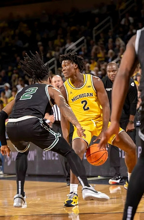 L.J. Cason (2) and Cleveland State Head Coach Daniyal Robinson