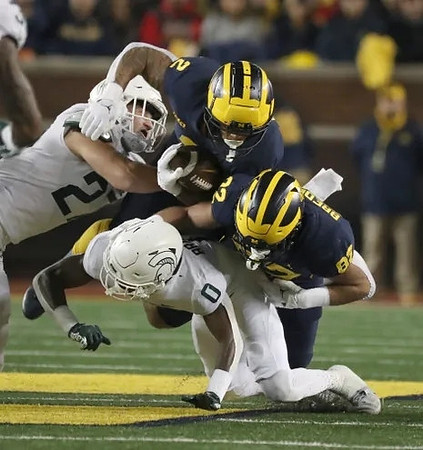 Blake Corum (2) and Max Bredeson (82)