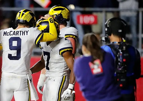J.J. McCarthy (9) and Donovan Edwards (7)