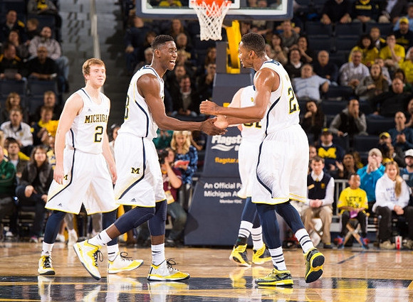 Spike Albrecht (2), Caris LeVert (23), and Aubrey Dawkins (24)