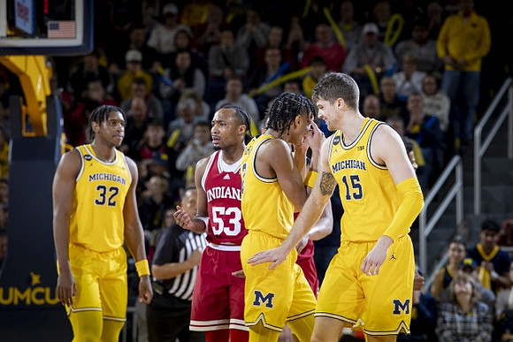 Tarris Reed Jr. (32), Kobe Bufkin (2), and Joey Baker (15)