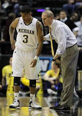 Trey Burke (3) and John Beilein