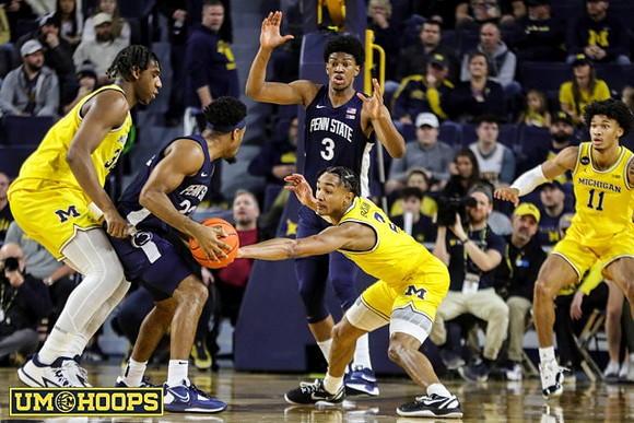 Tarris Reed Jr. (32), Kobe Bufkin (2), and Isaiah Barnes (11)