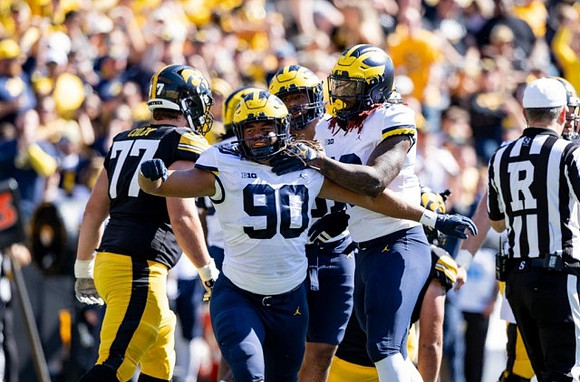 Mike Morris (90) and Eyabi Anoma Okie (18)