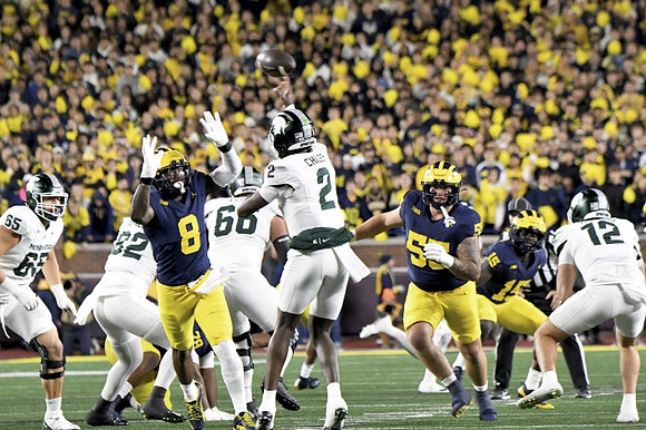 Derrick Moore (8), Mason Graham (55), and Ernest Hausmann (15)