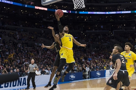 Zavier Simpson (3) and Isaiah Livers (4)