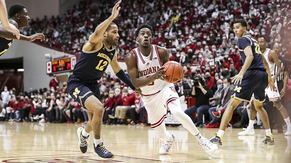 Moussa Diabate (14), DeVante' Jones (12), and Caleb Houstan (22)