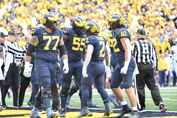 Trevor Keegan (77), Olusegun Oluwatimi (55), Blake Corum (2), Max Bredeson (82), and Ryan Hayes (76)