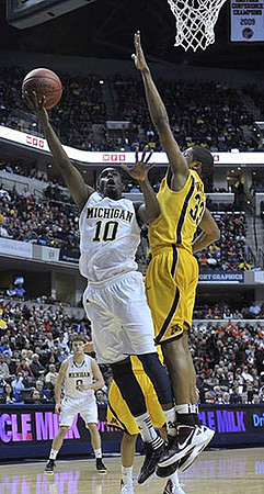 Zack Novak (0) and Tim Hardaway Jr. (10)
