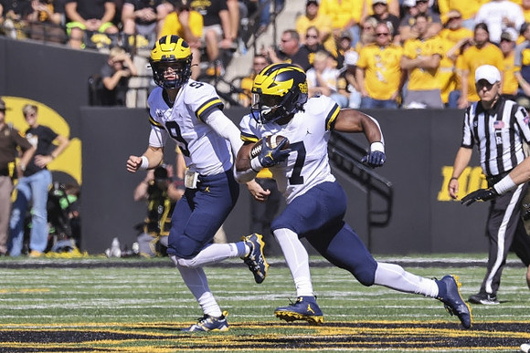 J.J. McCarthy (9) and Donovan Edwards (7)
