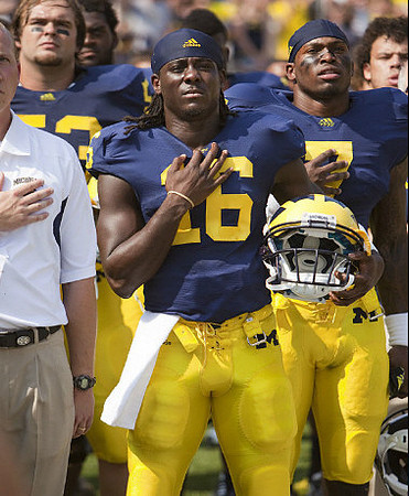 Ryan Van Bergen, Denard Robinson (16), and Devin Gardner (7)