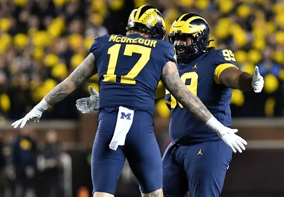 Braiden McGregor (17) and Cam Goode (99)