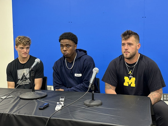 J.J. McCarthy (9) and Michigan Team