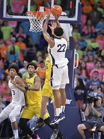 Tarris Reed Jr. (32) and Joey Baker (15)