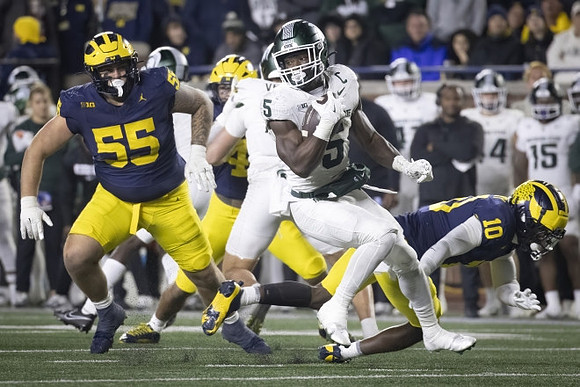 Mason Graham (55) and Zeke Berry (10)