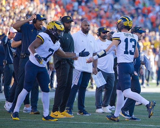 Jack Tuttle (13) and Michigan Team