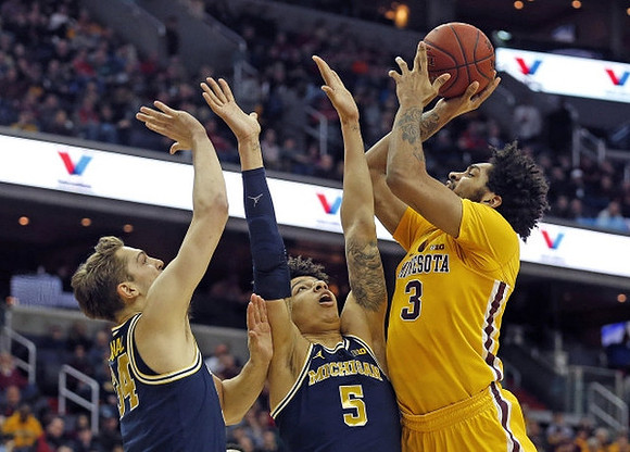 Mark Donnal (34) and D.J. Wilson (5)