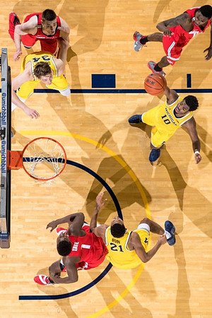 Mark Donnal (34), Zak Irvin (21), and Derrick Walton Jr. (10)