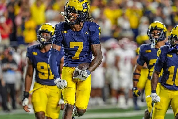 Cameron Brandt (91) and Makari Paige (7)