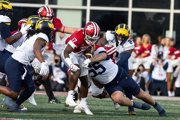 Jaishawn Barham (1), Mason Graham (55), and Derrick Moore (8)