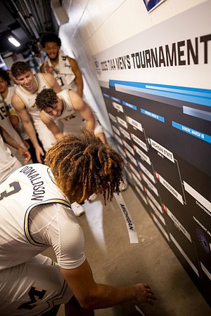 Tre Donaldson (3) and Michigan Team