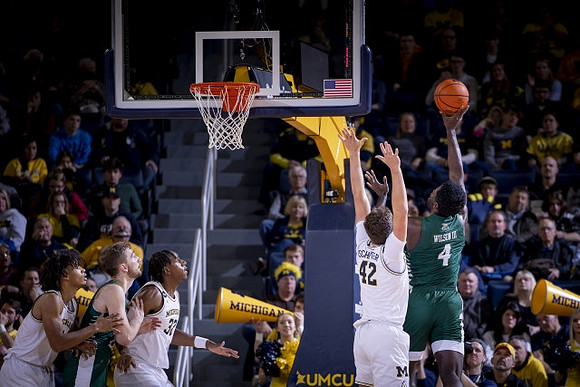 Isaiah Barnes (11), Tarris Reed Jr. (32), and Will Tschetter (42)