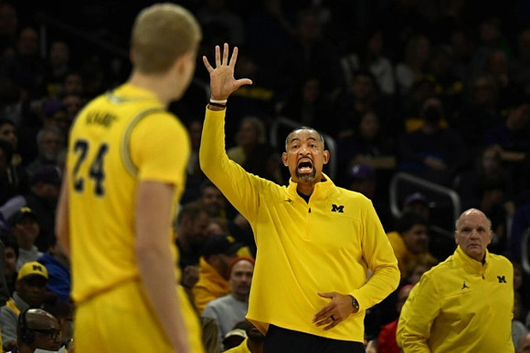 Youssef Khayat (24), Juwan Howard, and Phil Martelli