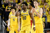 D.J. Wilson (5), Derrick Walton Jr. (10), and Mark Donnal (34)