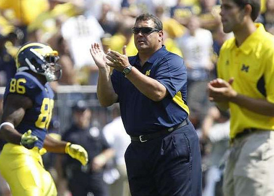 Kevin Koger (86) and Brady Hoke