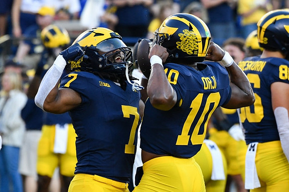 Donovan Edwards (7) and Alex Orji (10)