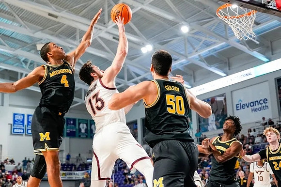 Nimari Burnett (4), Vladislav Goldin (50), L.J. Cason (2), and Sam Walters (24)