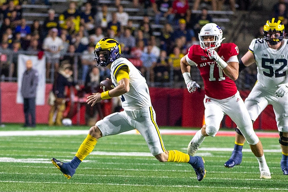 J.J. McCarthy (9) and Karsen Barnhart (52)